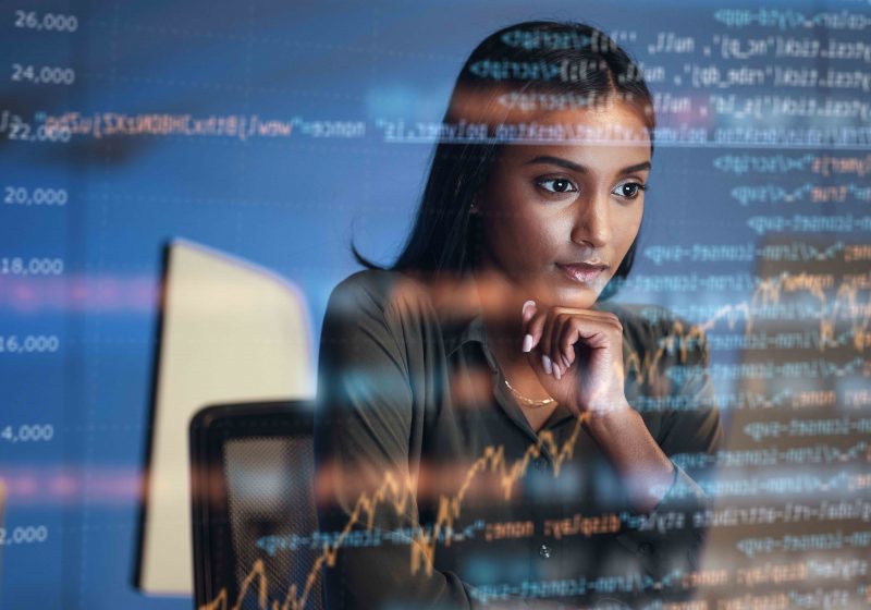 Lady analysing lines of code