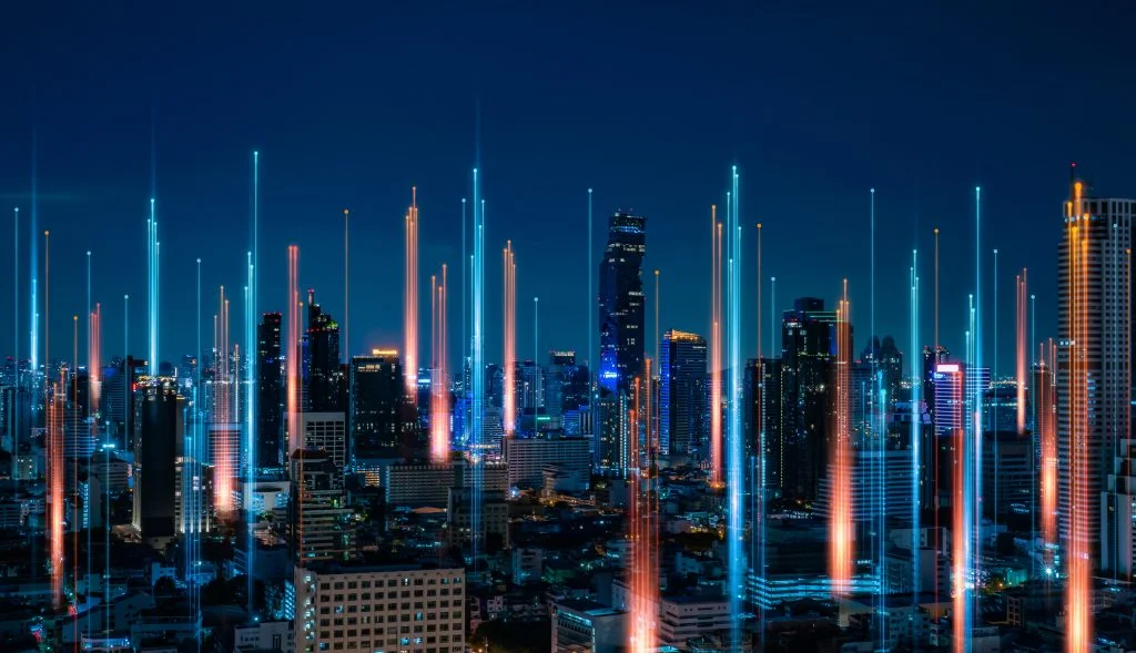 AnalystAccelerator.ai book a demo. City skyline at night with long exposure lights