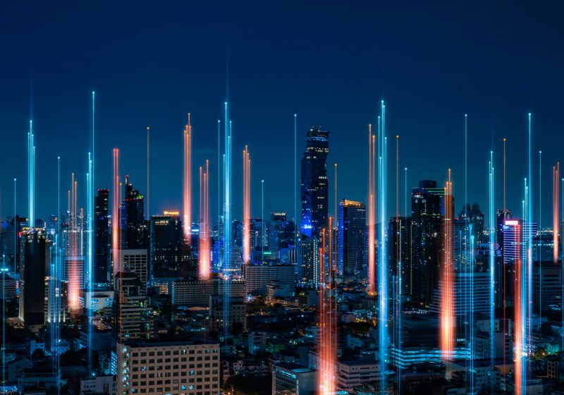 AnalystAccelerator.ai book a demo. City skyline at night with long exposure lights