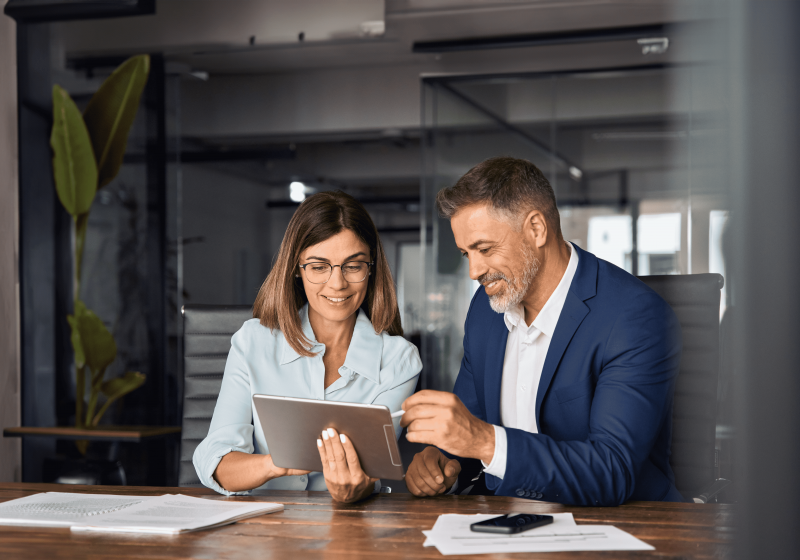 Business people working on a tablet at a desk
