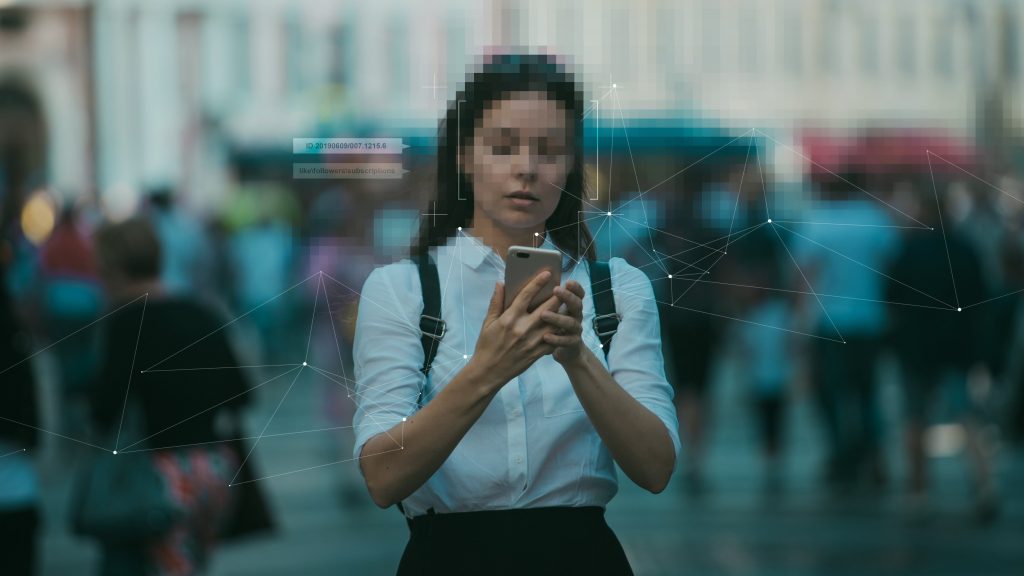 Phone scanning lady's facial features