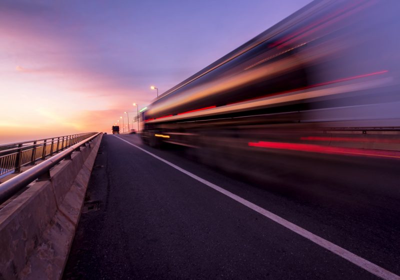 Lorry moving quickly. Lights blur out of focus