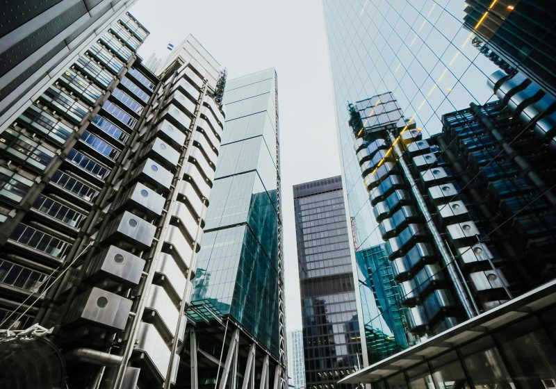 Looking up at big glass city skyscrapers